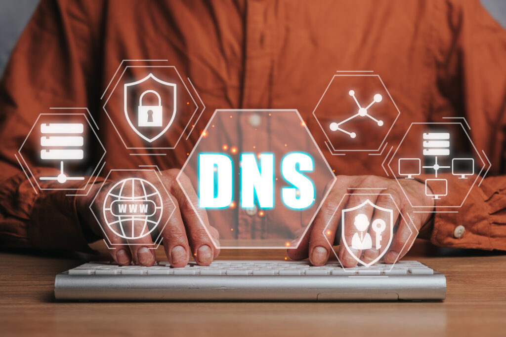 A visual representation of DNS security: a person interacting with a digital interface featuring DNS and security symbols