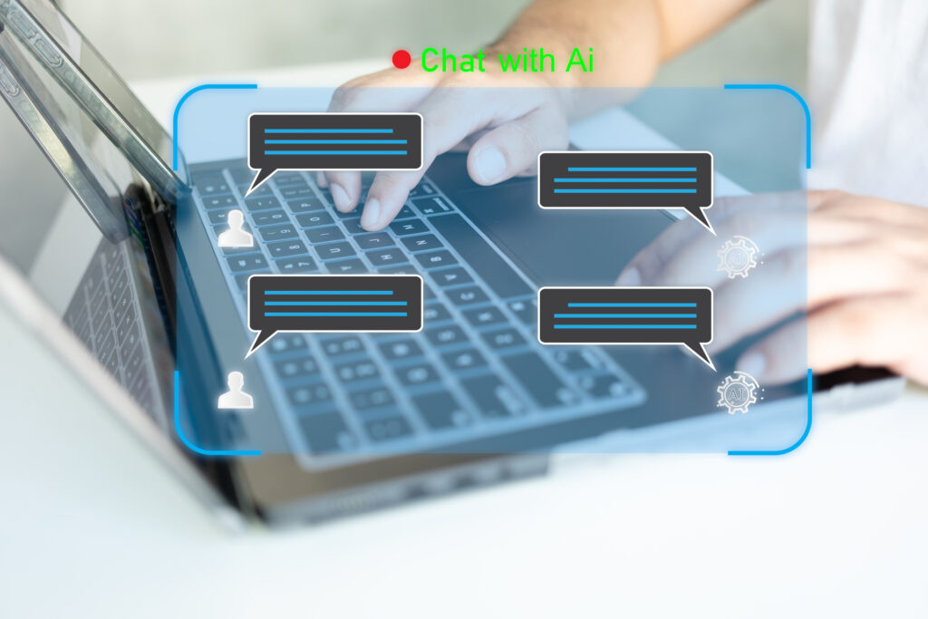 A person typing on a laptop keyboard with an overlay of chat bubbles and icons, indicating a conversation with an AI system.