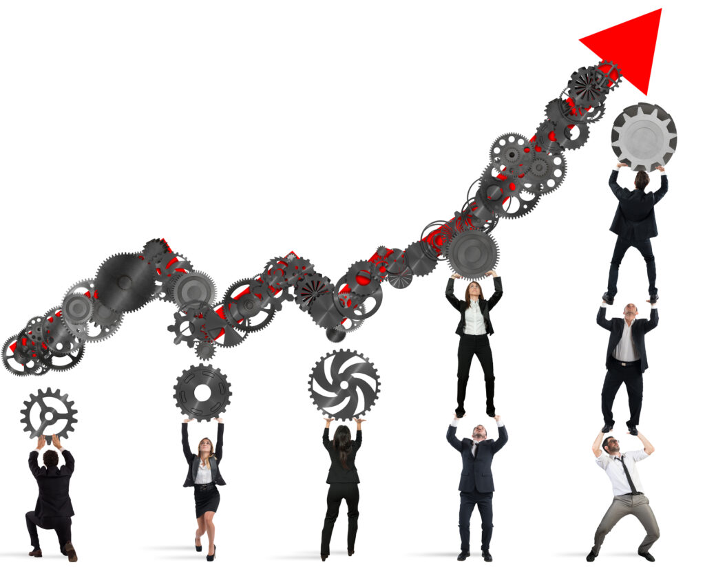 A group of professionals in business attire lifting and balancing interconnected gears forming an ascending graph line, culminating in a red upward-pointing arrow. This symbolizes the integration of artificial intelligence in boosting sales performance.