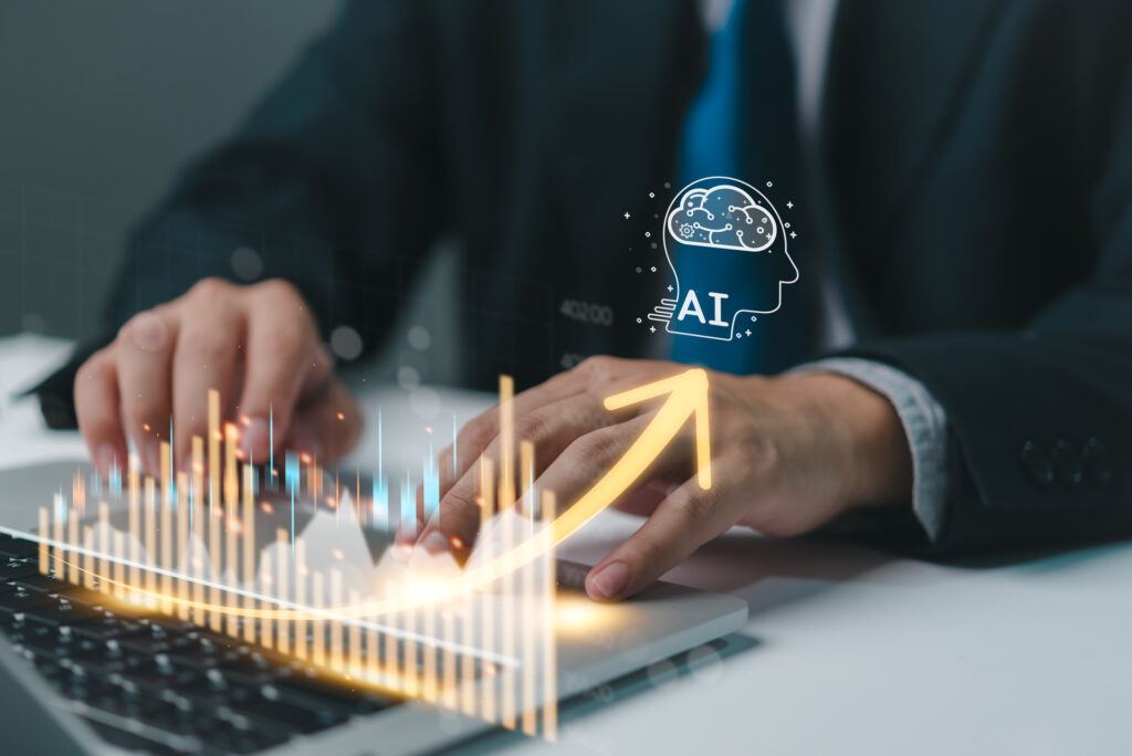 A professional in a suit interacts with a holographic display of rising financial graphs, symbolizing growth, with an icon representing “sales AI” floating above, indicating the use of artificial intelligence in sales data analysis.