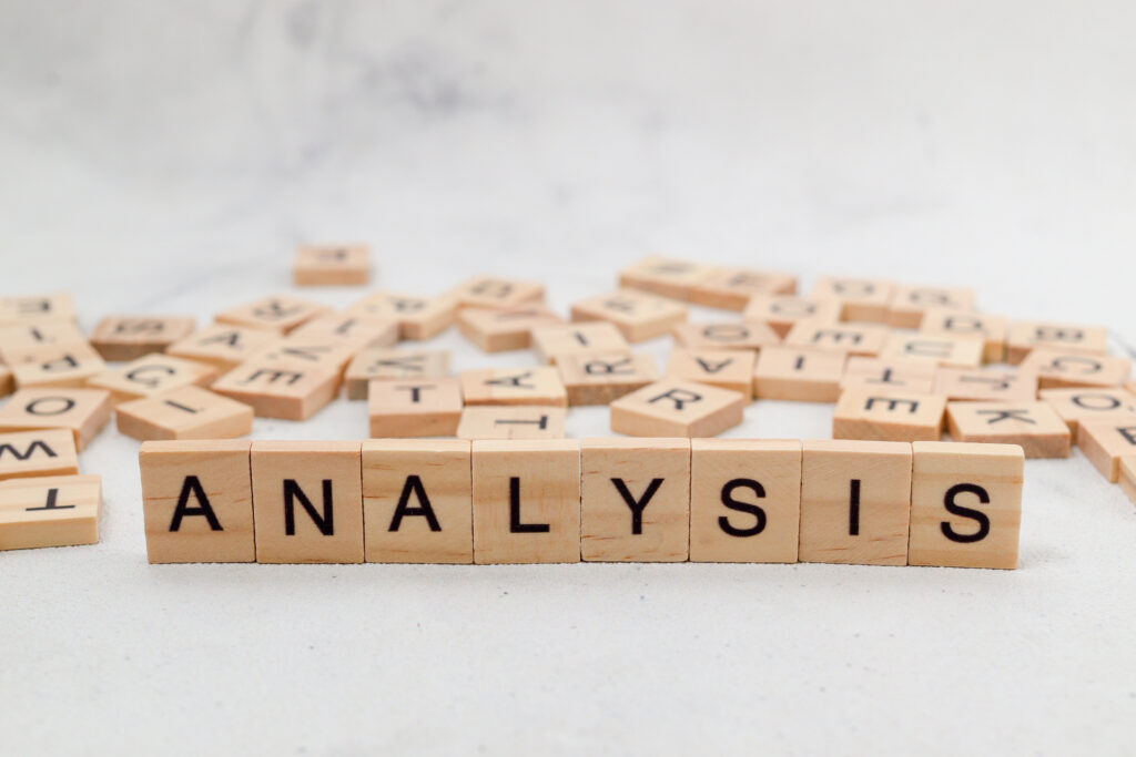 The word "ANALYSIS" spelled out with letter tiles, emphasizing the importance of data analysis in sales.