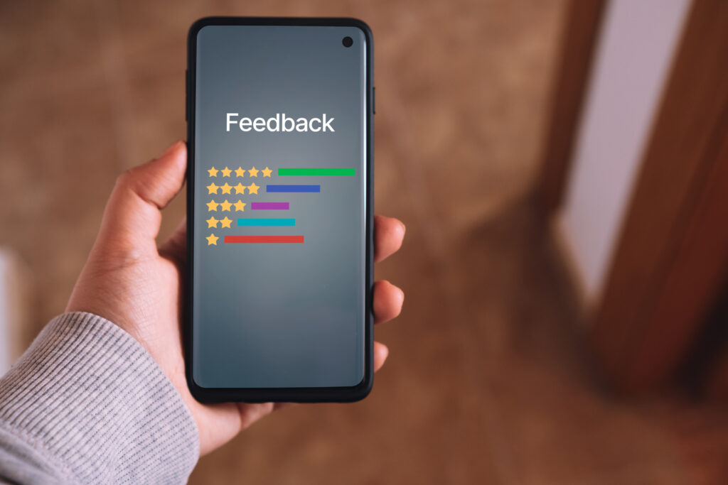 A smartphone displaying a customer feedback survey with star ratings. AI can analyze these responses to identify trends and improve products or services.