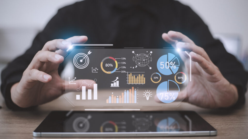 AlphaCalc Business Intelligence: Interactive data visualization. A person uses a tablet to explore insights from a variety of charts and graphs.