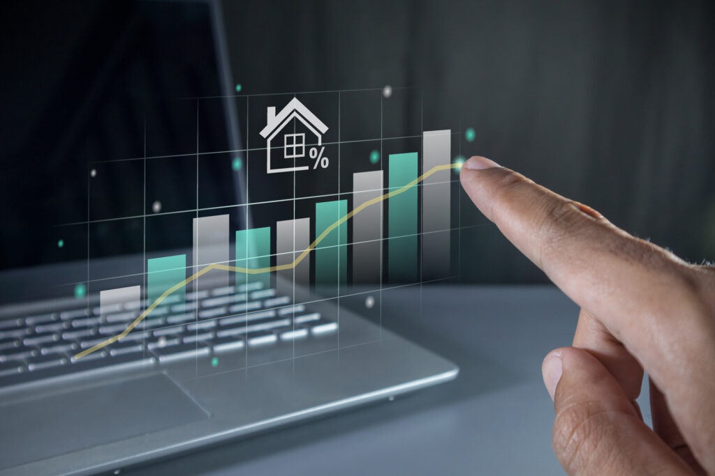 A bar graph with a house icon and an upward trend, symbolizing the digital transformation of the real estate market and the potential for increased value.