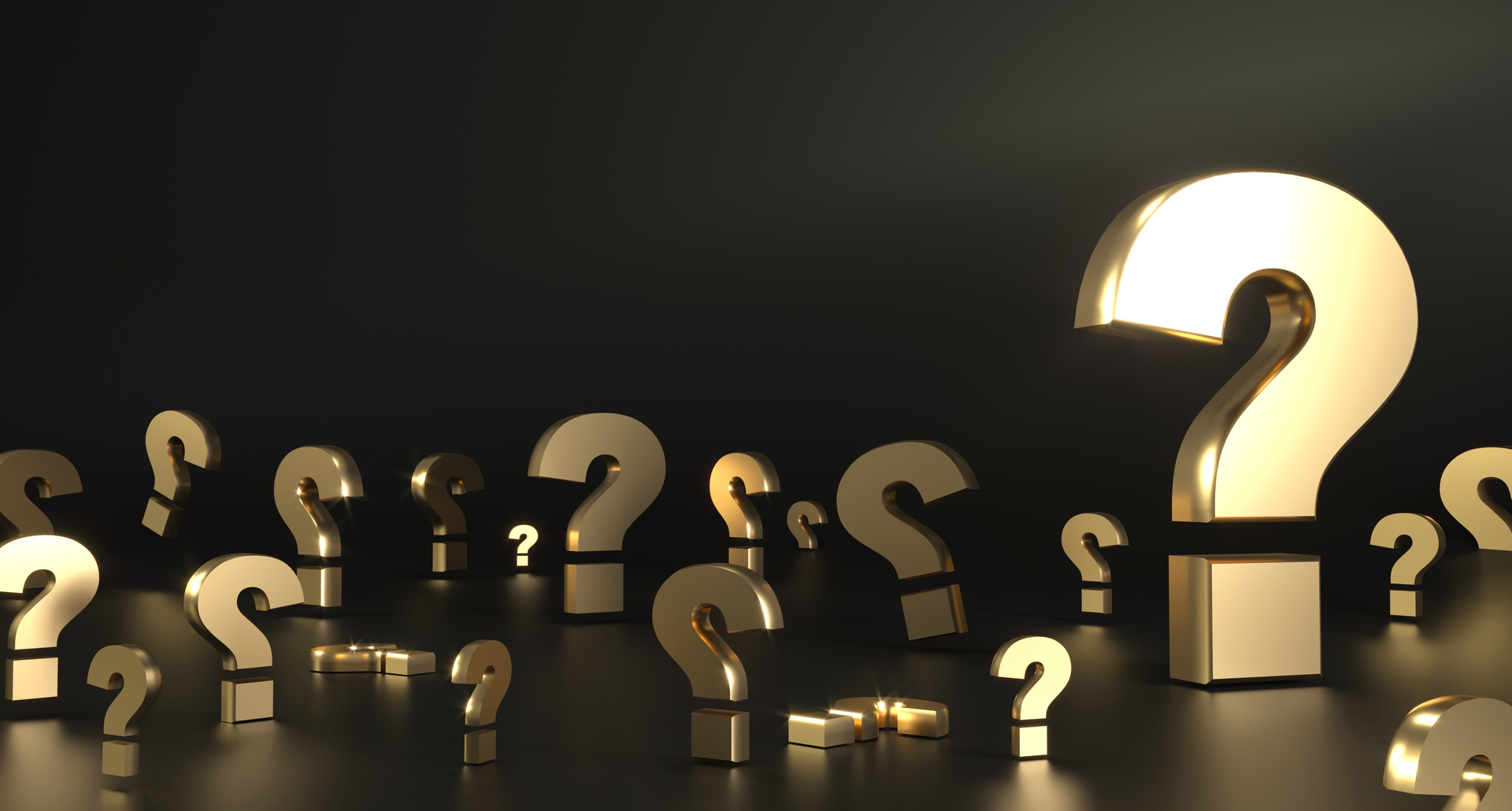 A cluster of golden question marks on a dark background, symbolizing the process of product discovery and the numerous questions that arise during the development of a new product.