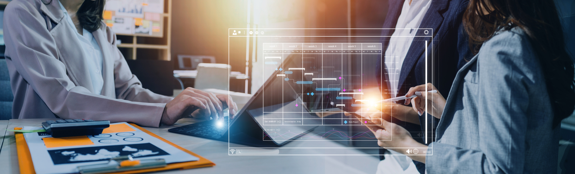 Two professionals collaborate during the project discovery phase, using a tablet to review a Gantt chart and other project planning tools. The image highlights teamwork and the importance of digital tools in project discovery