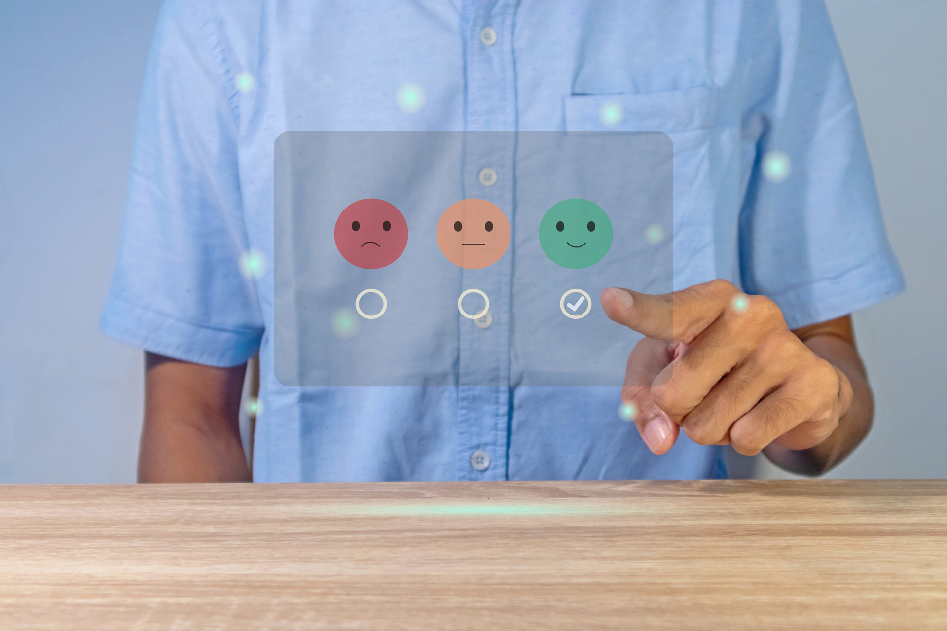 A person interacts with a virtual interface showing a range of emojis, representing varying levels of health. This symbolizes SAGLIK LOKMAN's innovative symptom checker that guides users towards appropriate health solutions.